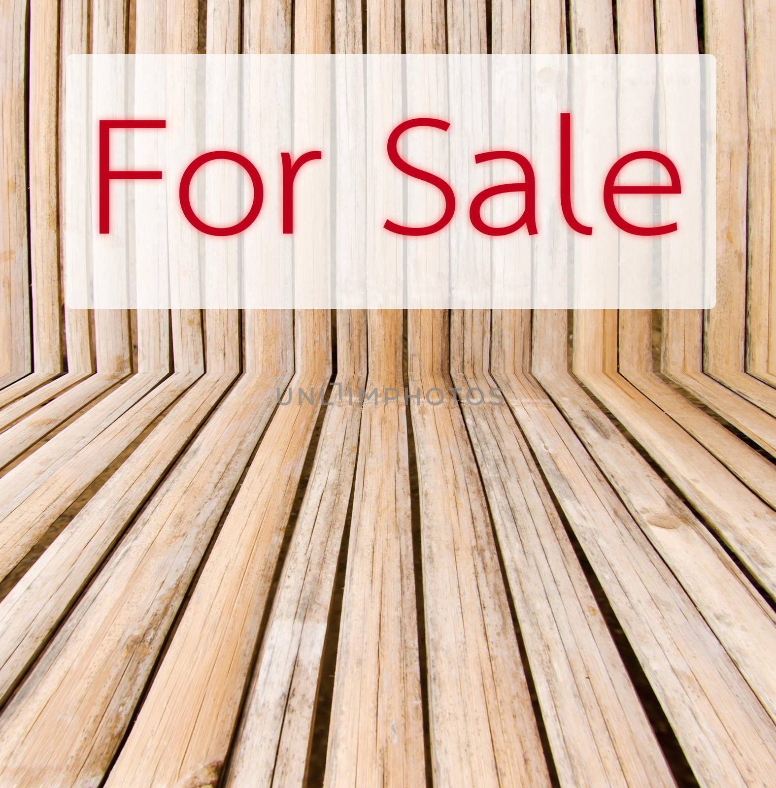 Sale tag on wooden background.