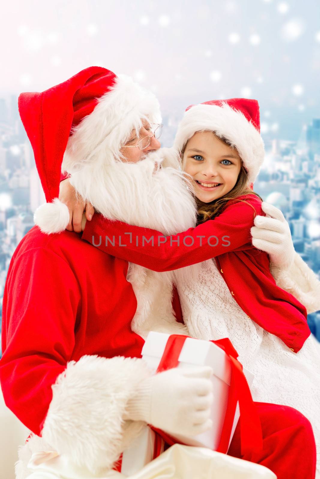 smiling little girl with santa claus and gifts by dolgachov