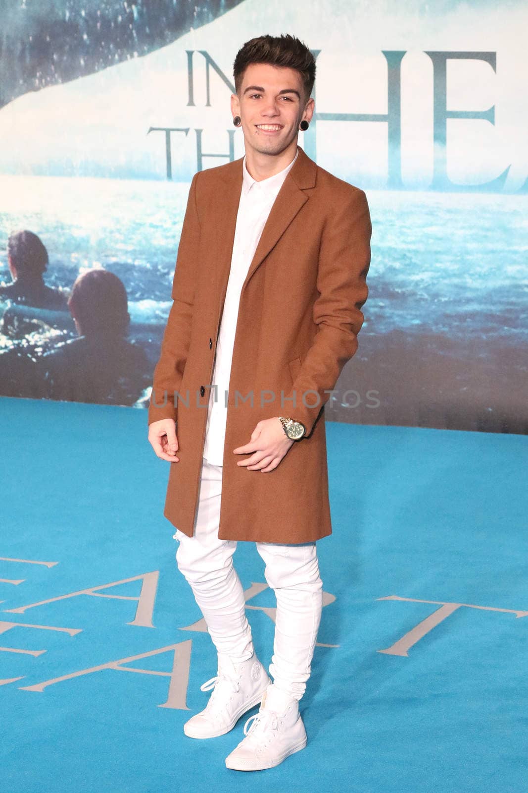 UNITED KINGDOM, London: X Factor star Jake Sims poses for photographers during the premier of In the Heart of the Sea, a Ron Howard movie, in London on December 2nd, 2015.