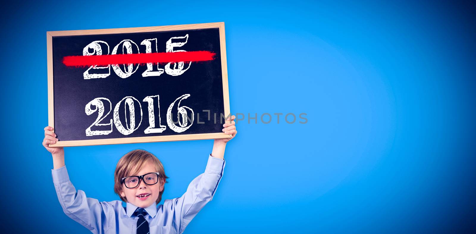 Cute pupil holding chalkboard against blue background with vignette