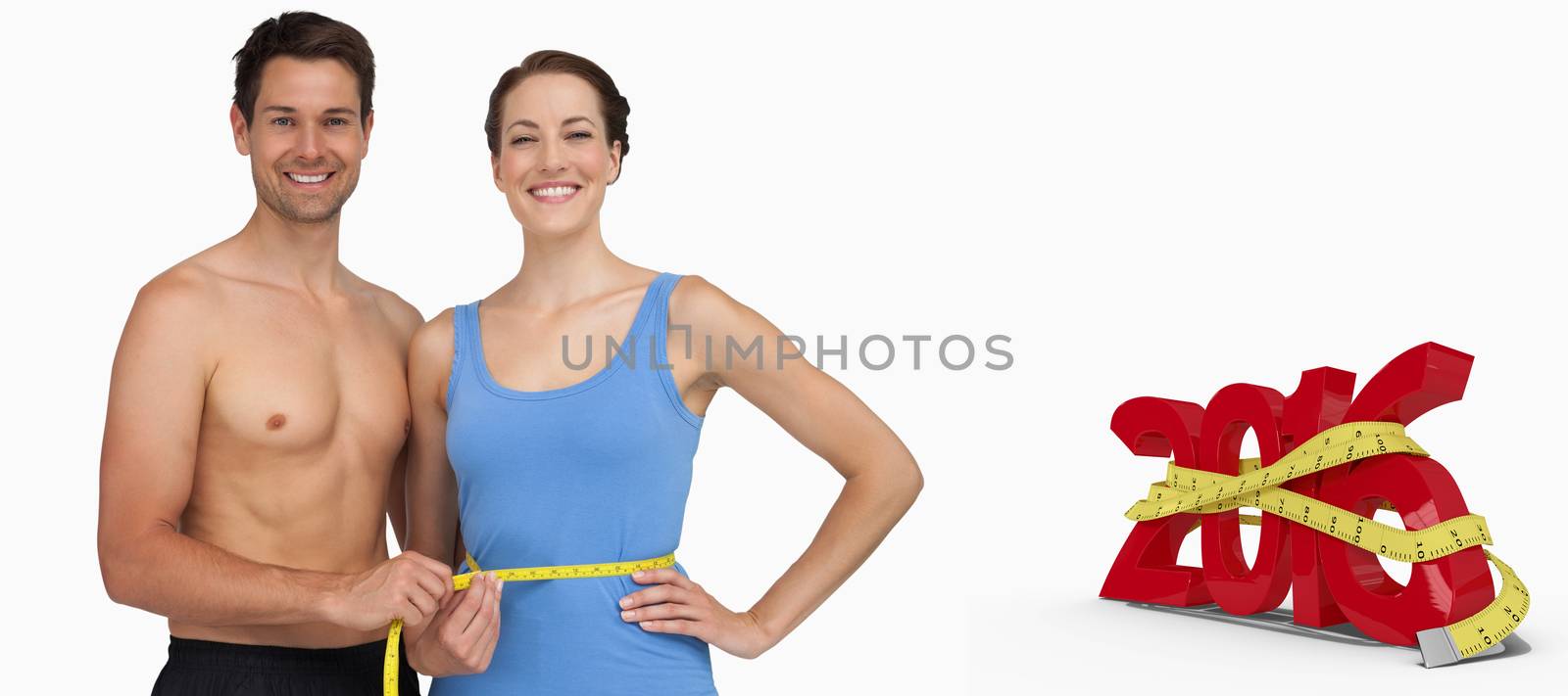 Fit young man measuring womans waist against white background with vignette