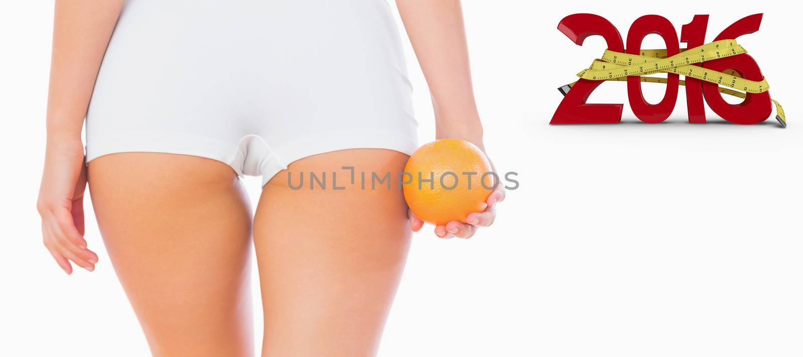 Composite image of midsection of woman holding orange by Wavebreakmedia