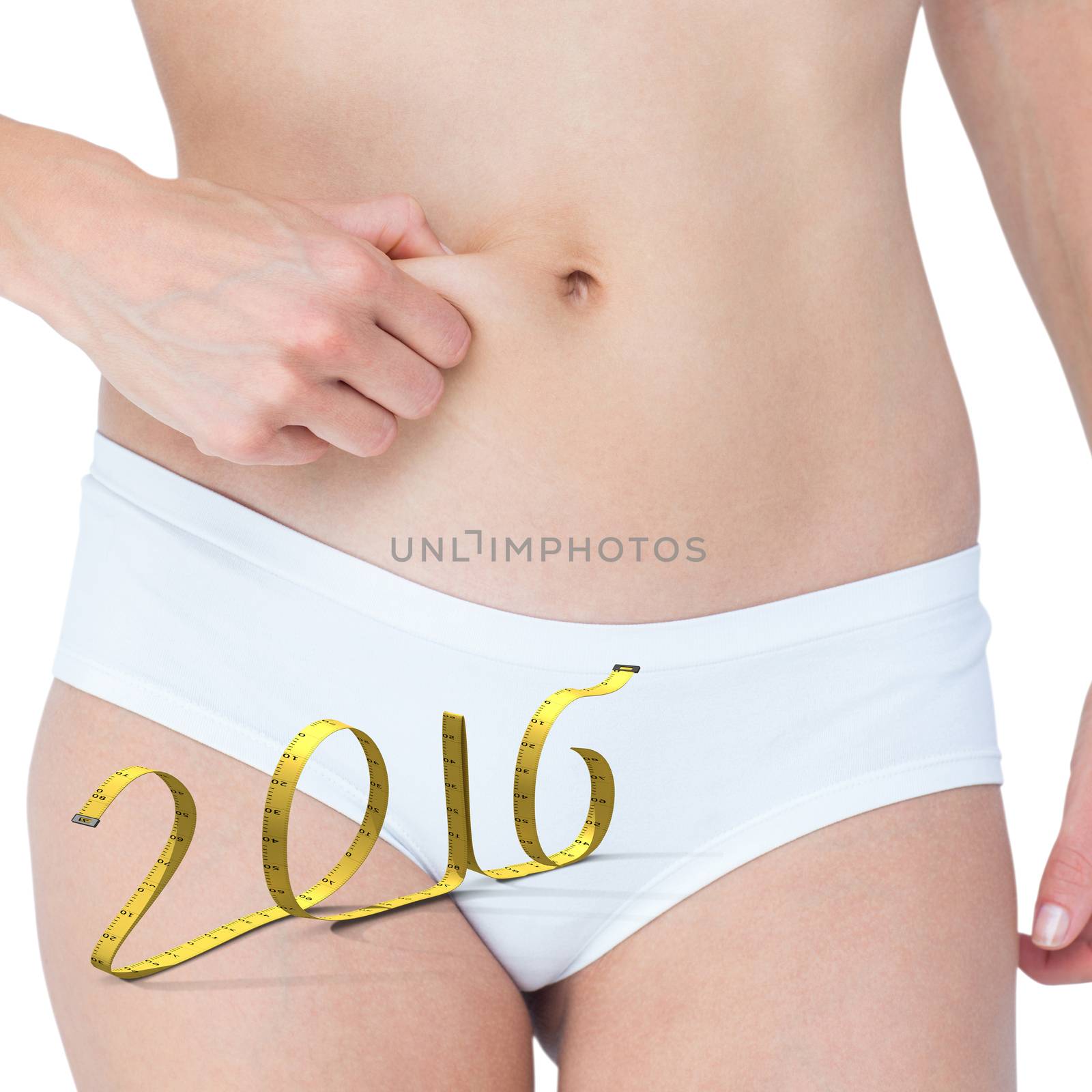 Composite image of woman with little fat on her belly by Wavebreakmedia