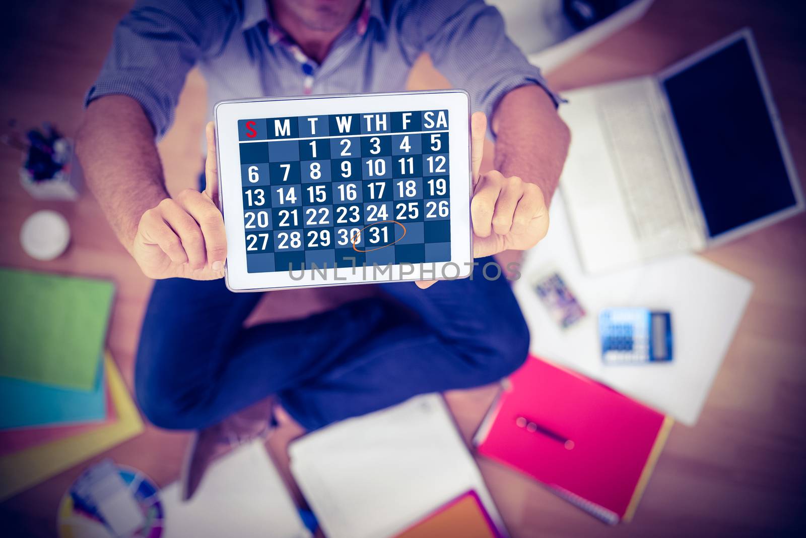 Technology lock screen against businessman showing tablet computer in creative office