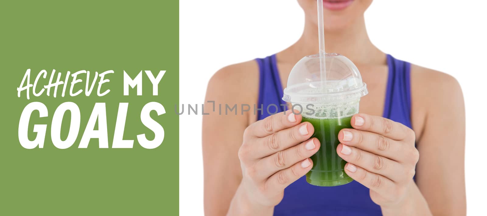 Composite image of woman showing green juice in goblet by Wavebreakmedia