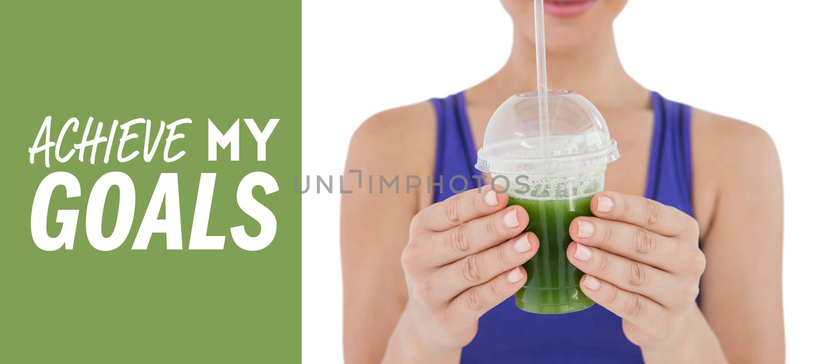 Woman showing green juice in goblet against green vignette