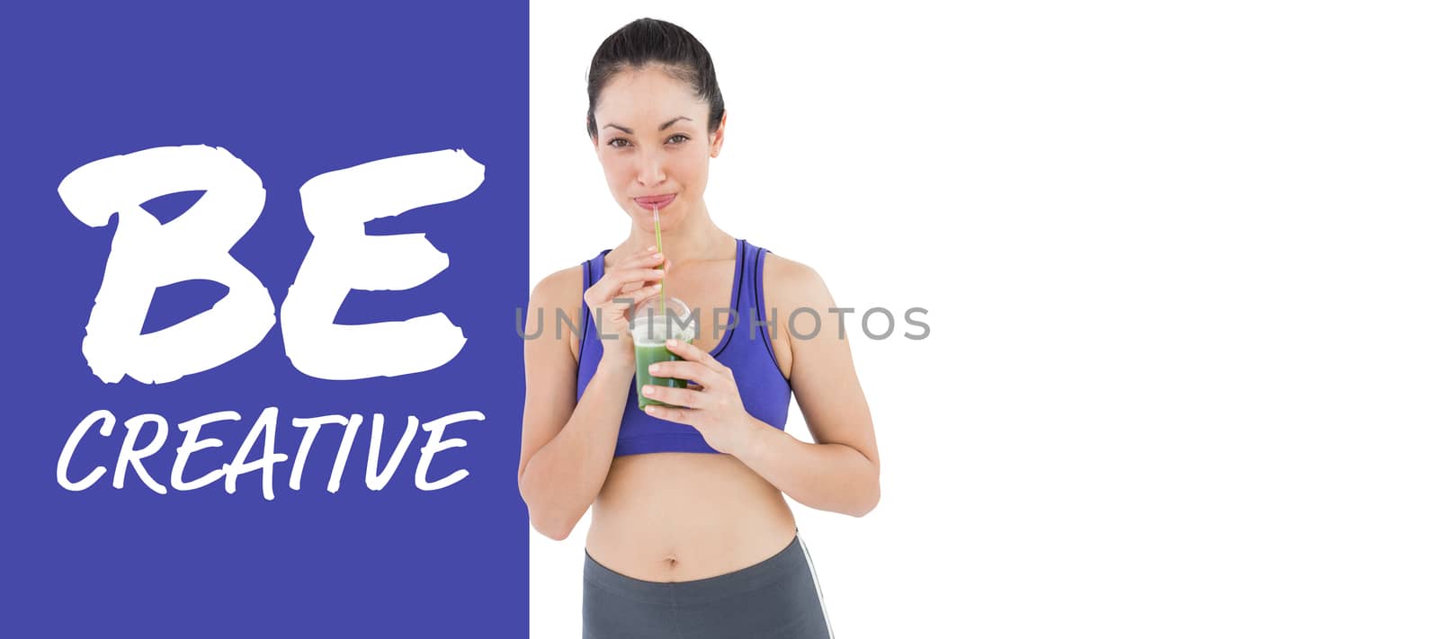 Attractive woman drinking green juice against purple vignette