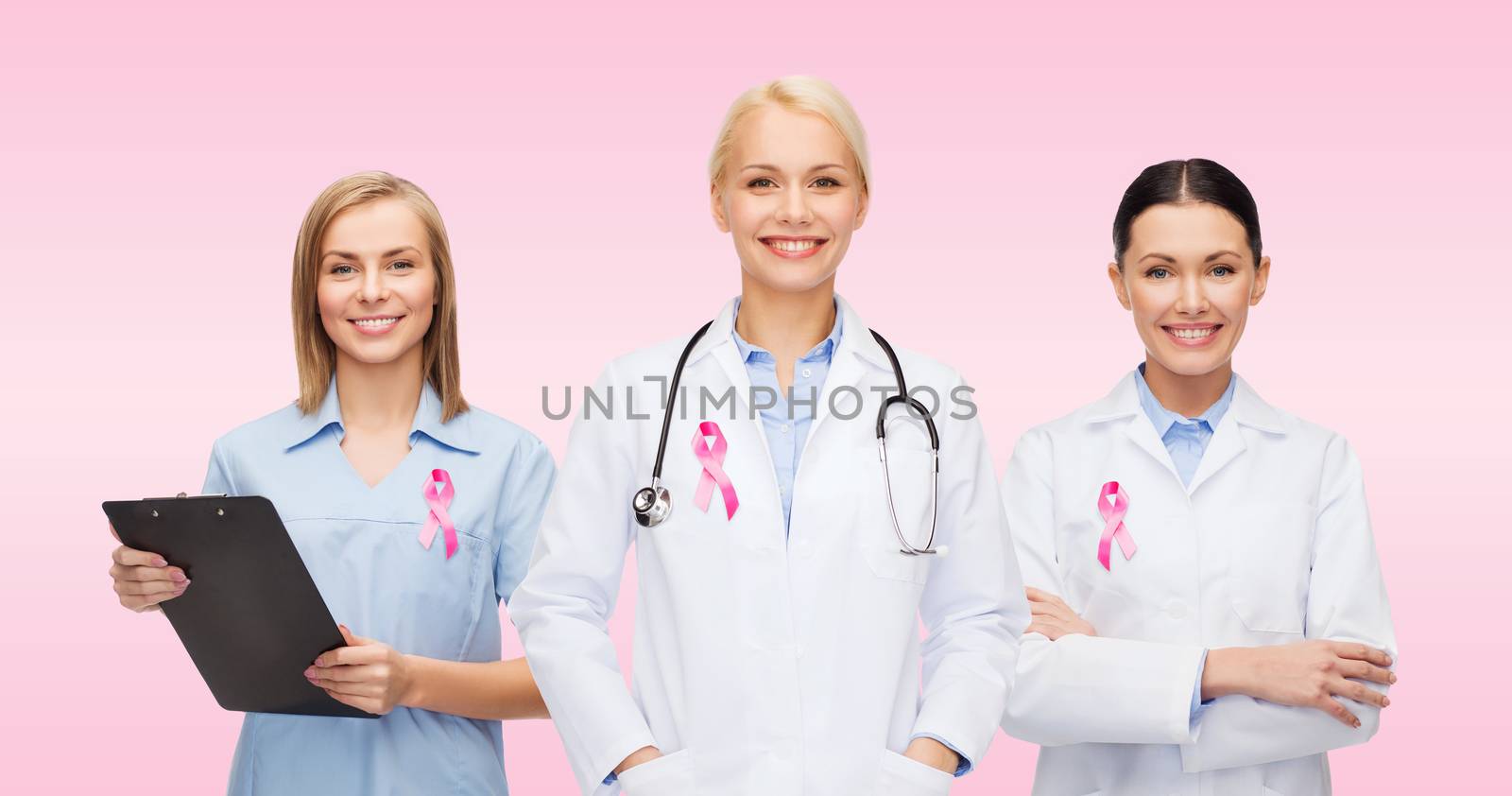 female doctors with breast cancer awareness ribbon by dolgachov