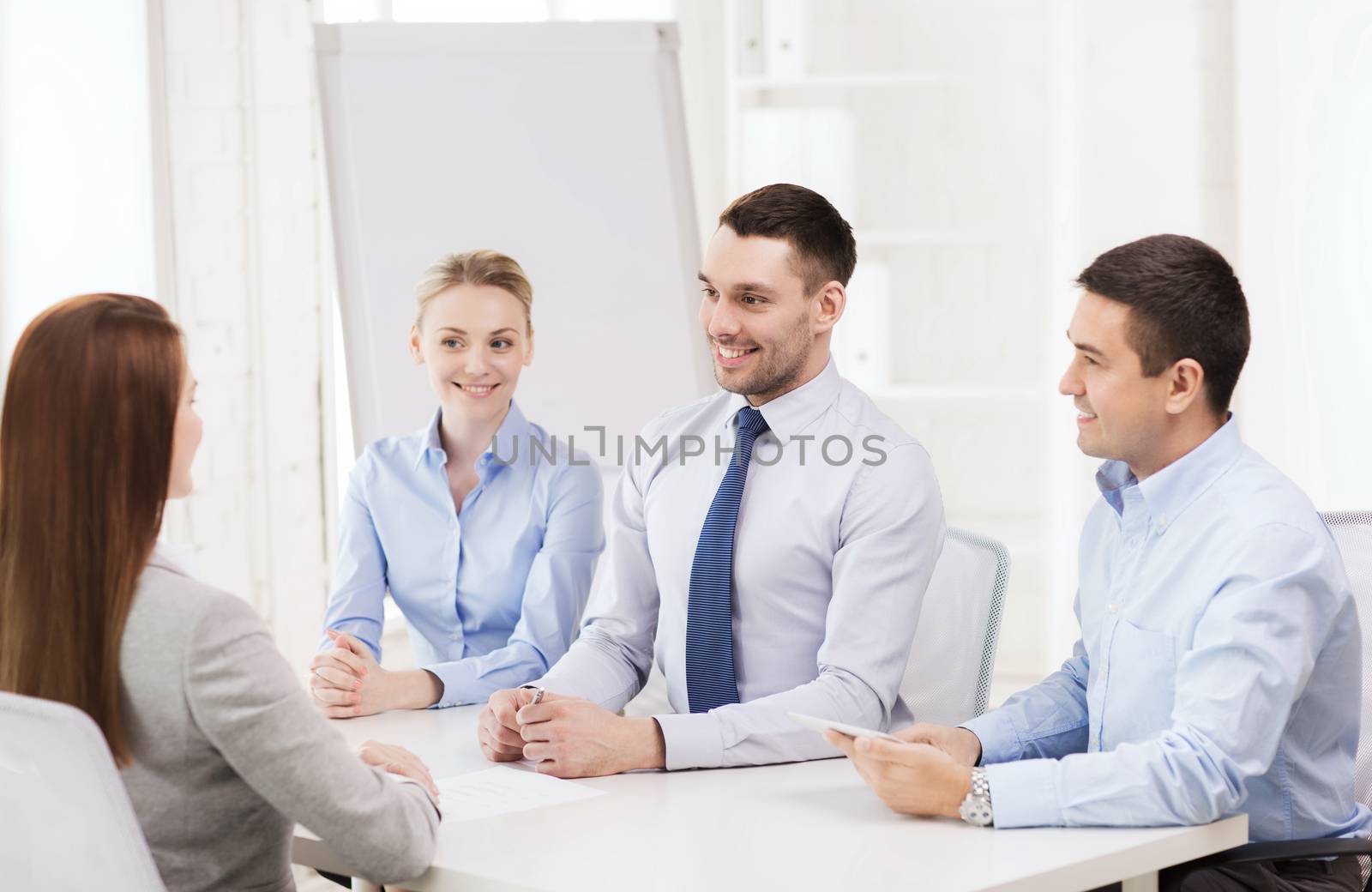 business, interview, employment and office concept - business team with tablet pc computer interviewing worker in office