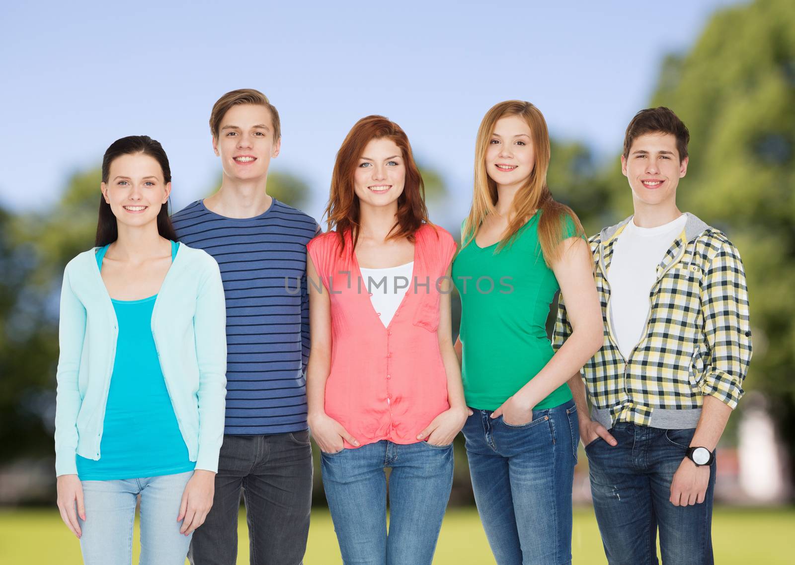 education and people concept - group of smiling students standing