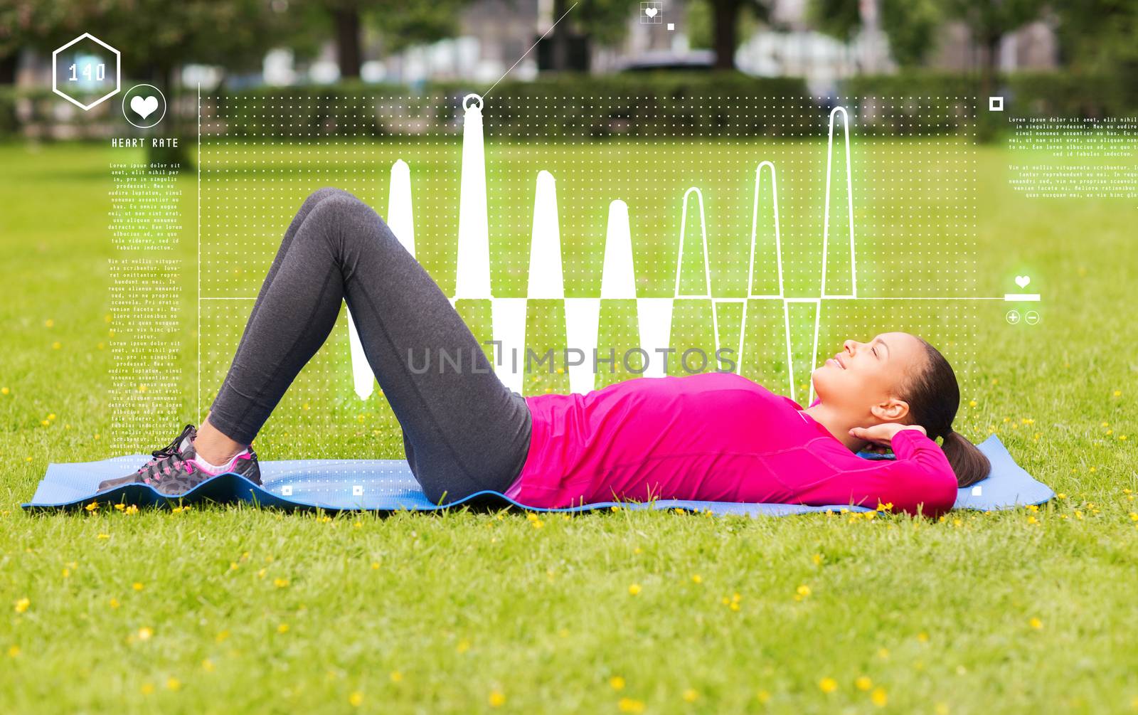 smiling woman doing exercises on mat outdoors by dolgachov