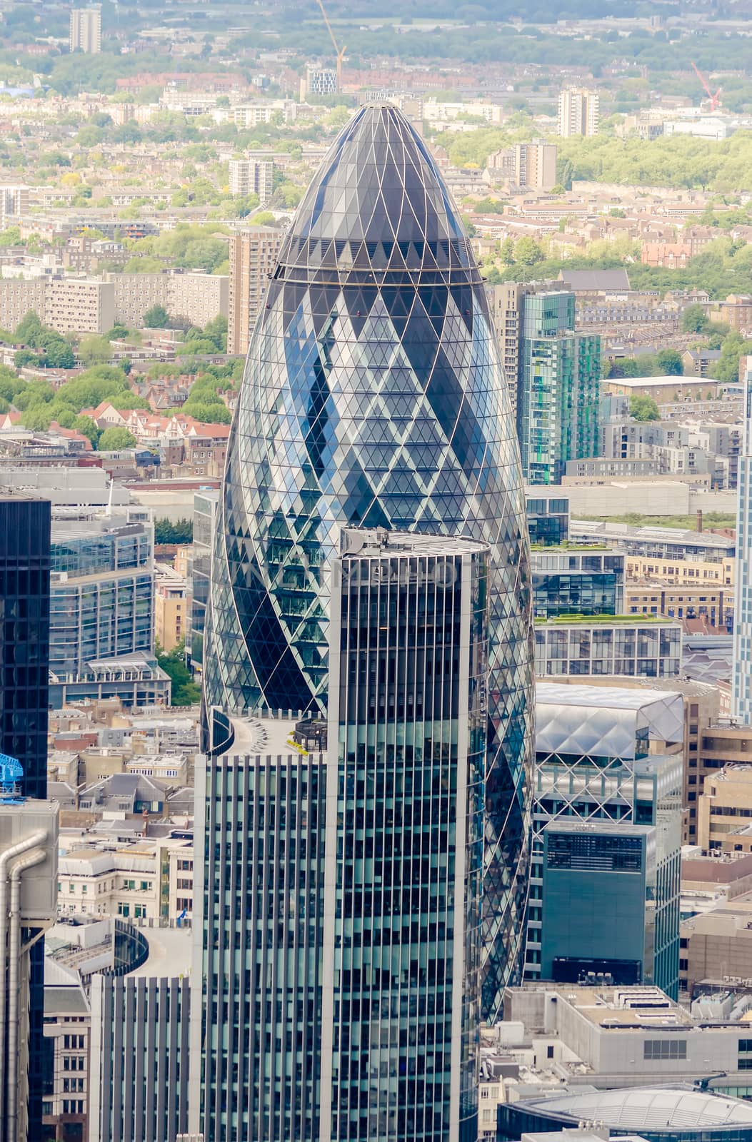 LONDON - MAY 29: The Gherkin building (30 St Mary Axe) in London on May 29, 2015. Iconic landmark of London, this is one of the city's most widely recognized examples of modern architecture.