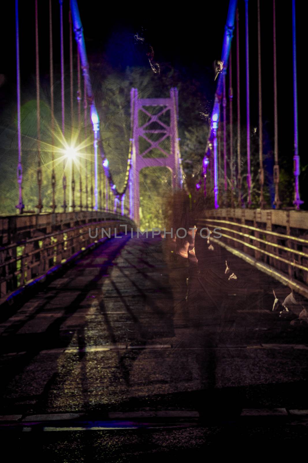 Non-descript ghostly male figure walking on bridge, defocused and texture applied