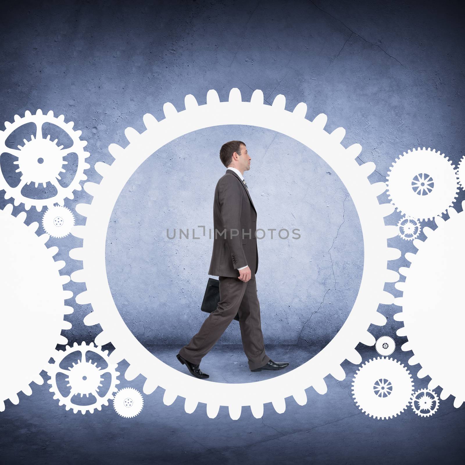 Businessman walking in cog wheel by cherezoff