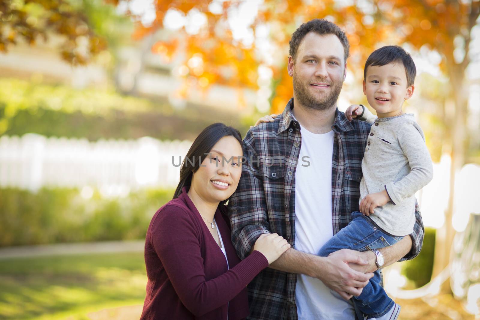 Mixed Race Young Family Portrait Outdoors by Feverpitched