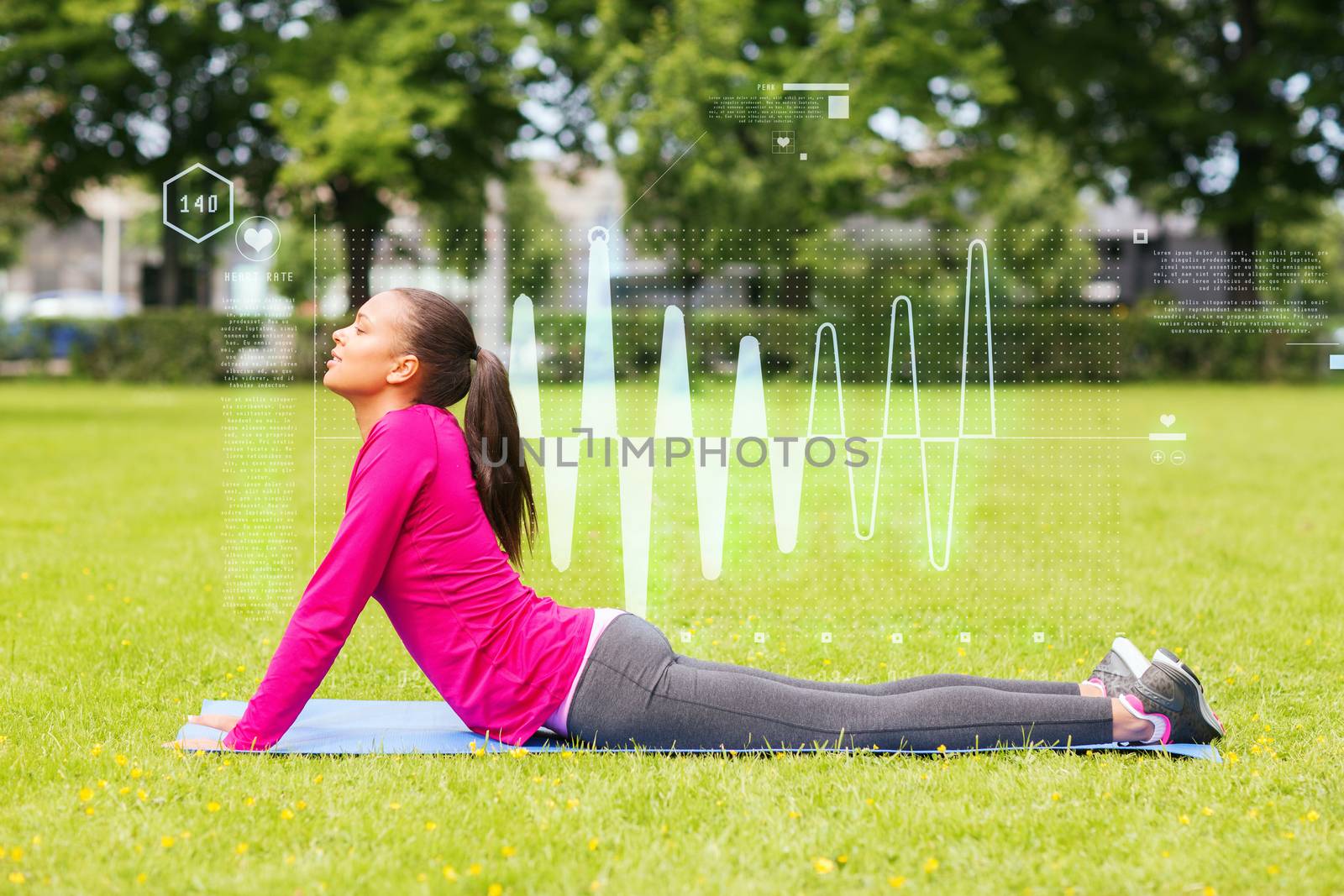 fitness, sport, training, park and lifestyle concept - smiling woman stretching back on mat outdoors