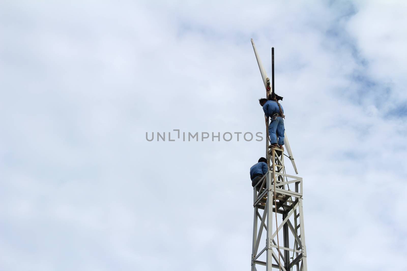 KHANH HOA, VIETNAM, September, 17: Workers fixing wind propeller on September, 17, 2013 in Khanh Hoa, Vietnam