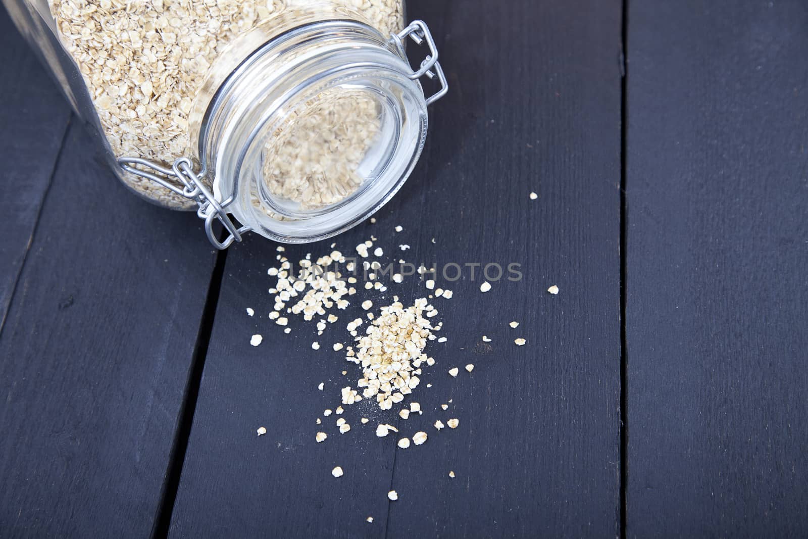 Oatmeal on dark wooden background