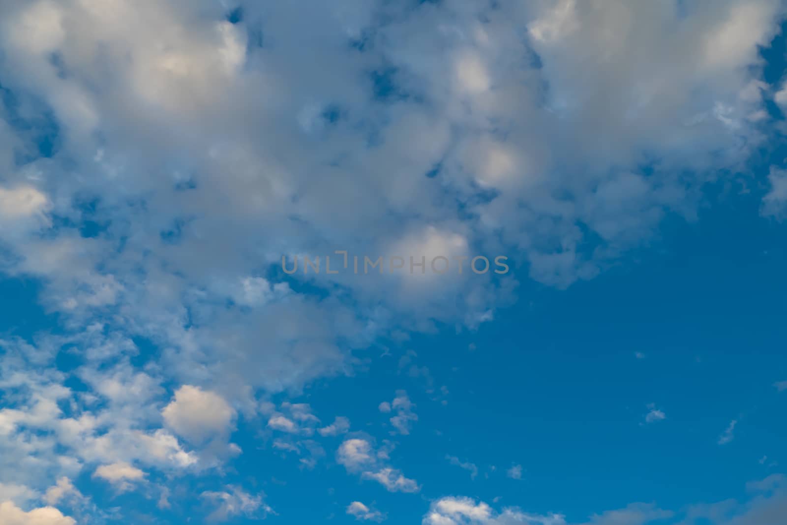 Cloudy blue sky abstract background, blue sky background with tiny clouds