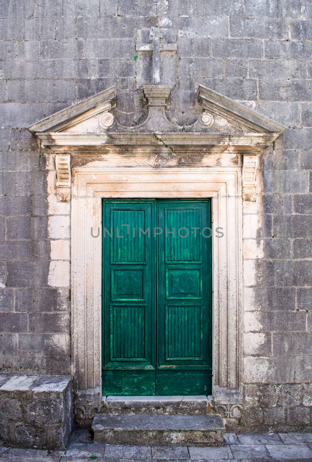 Green doors in Perast old town  by radzonimo