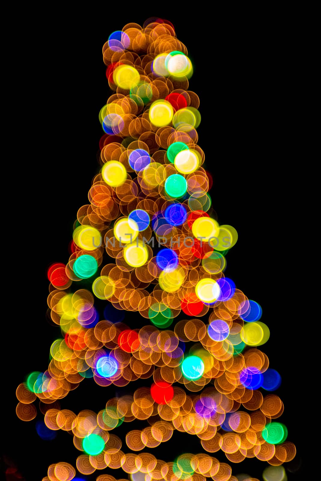 defocused christmas tree lights in a city background