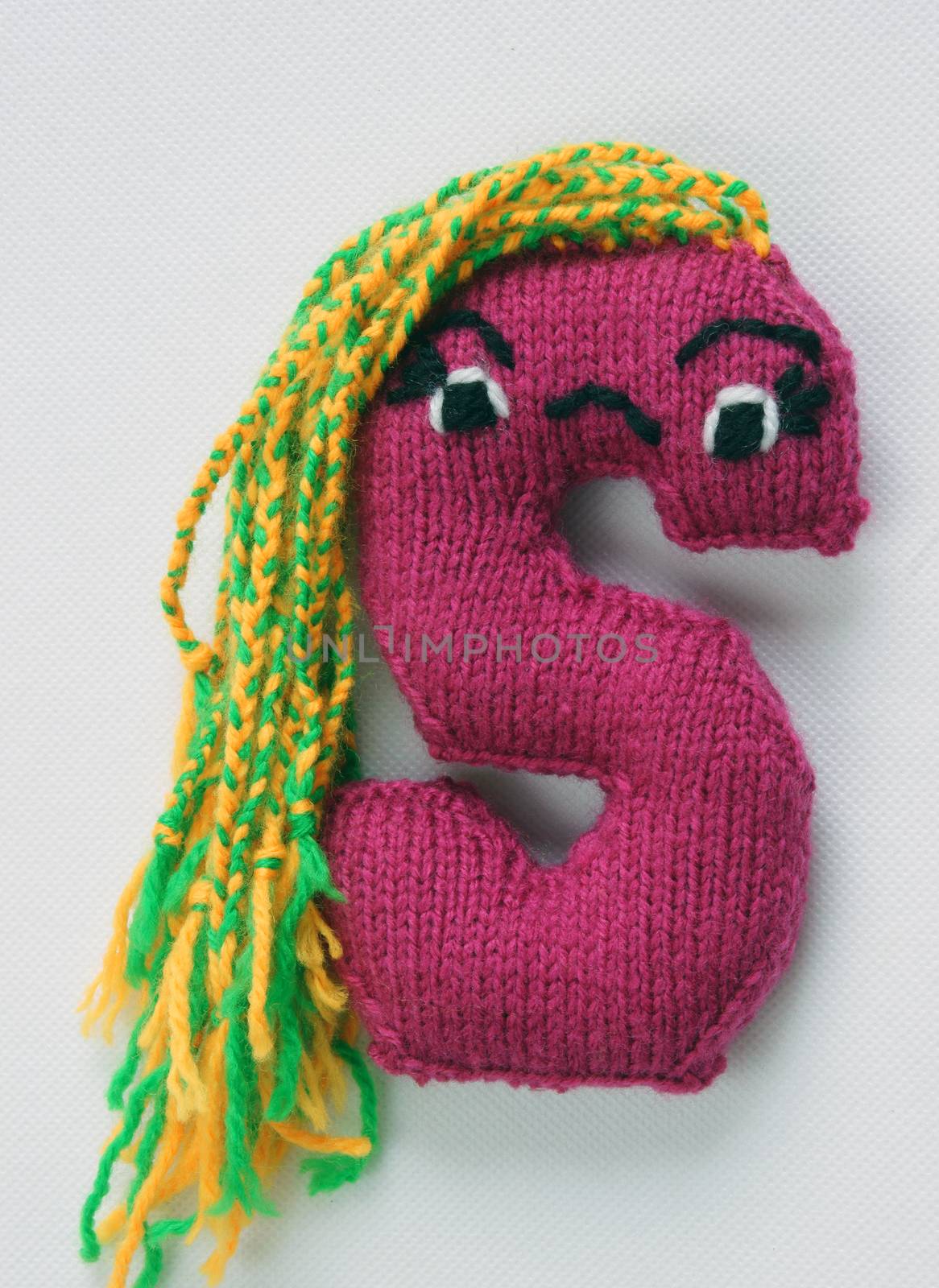 Amazing alpahbet on white background, knitted letter with emotion on face, feel with handmade toy, abc background with abstract hair