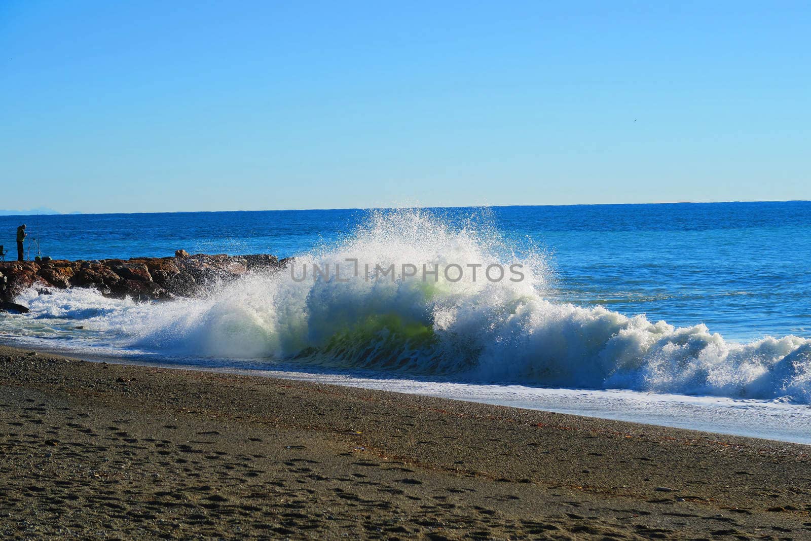 Big wave breaking on the beach in Savona, Liguria, Italy