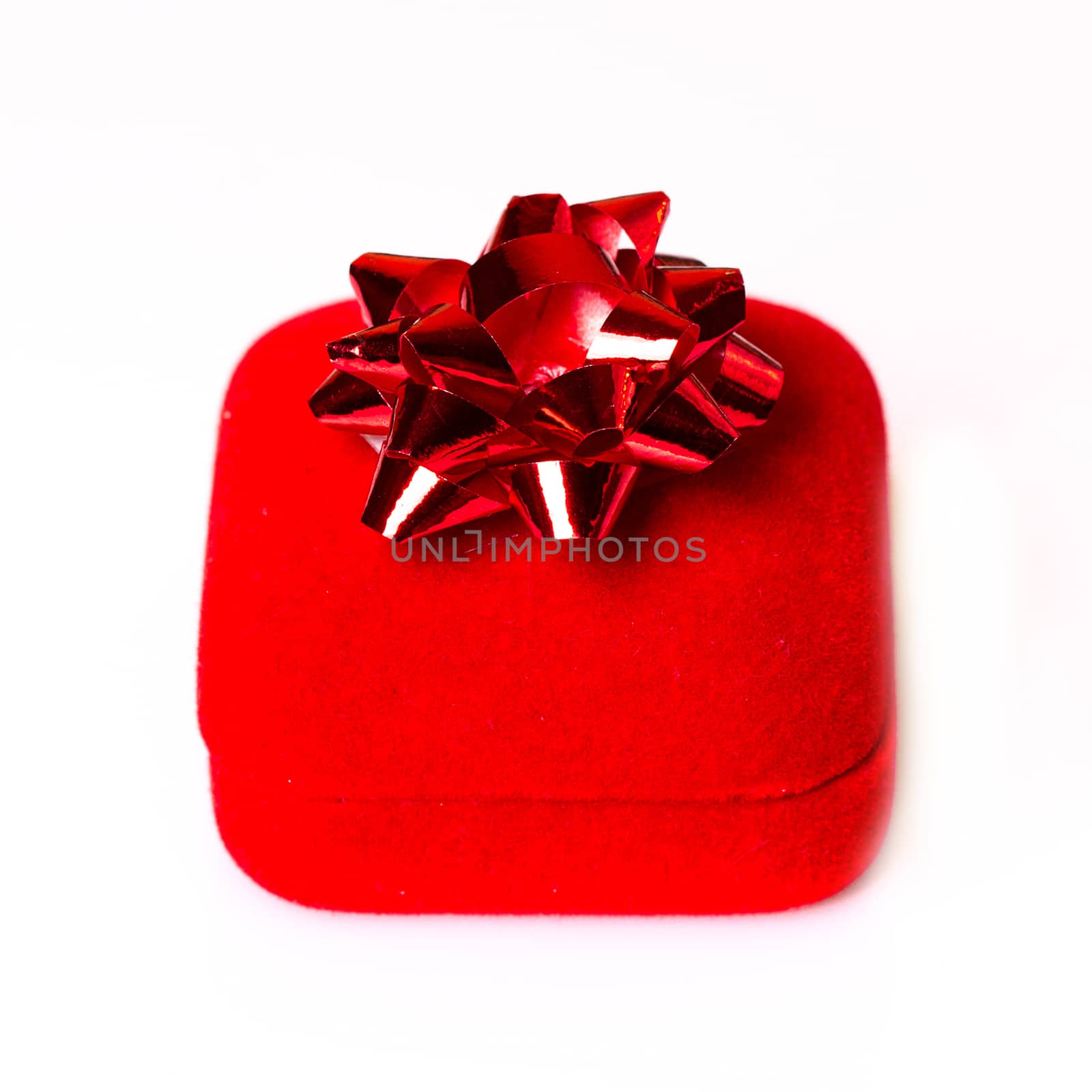 res Christmas gift with ribbon and bow isolated on white background