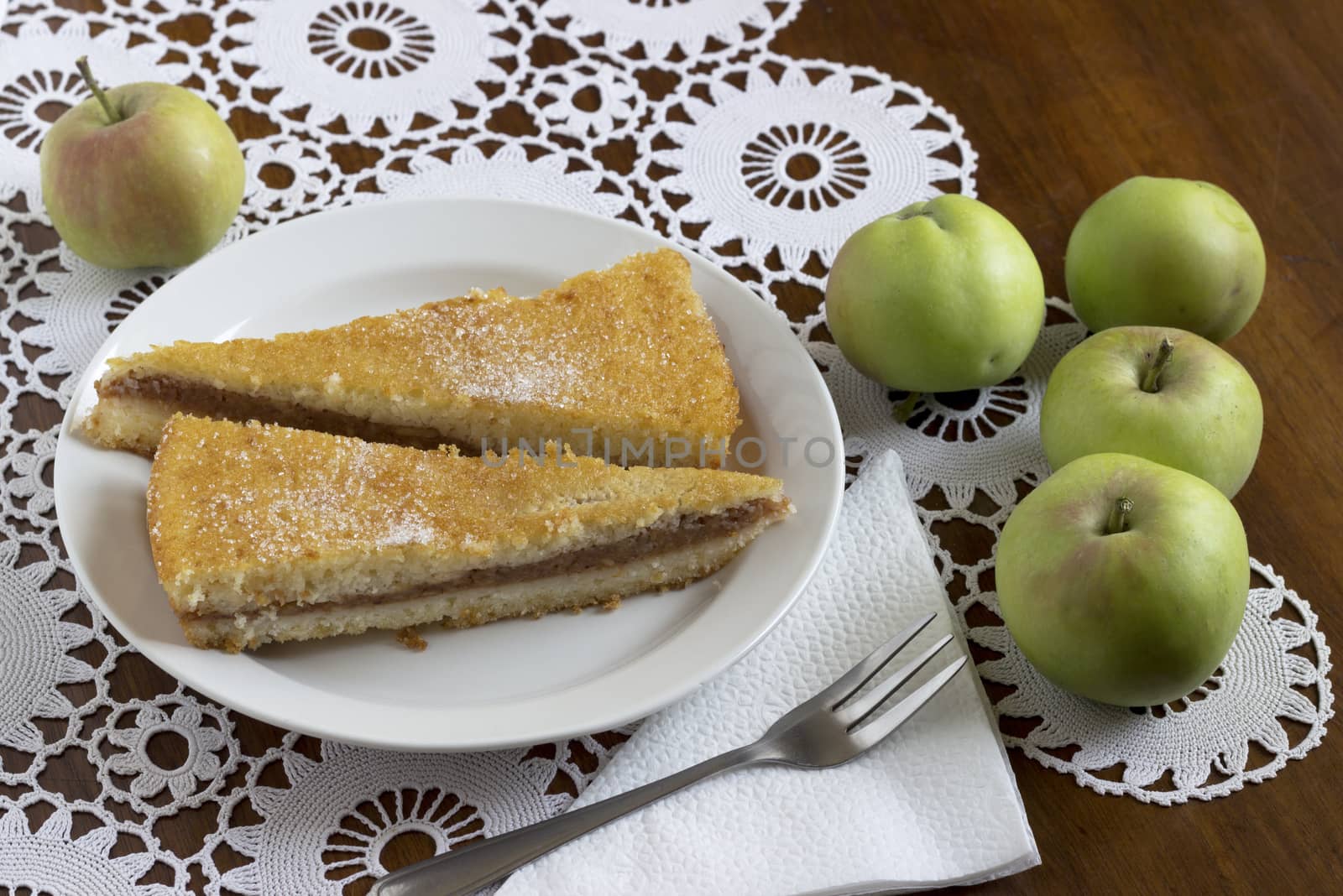 Freshly baked apple pie on wooden table