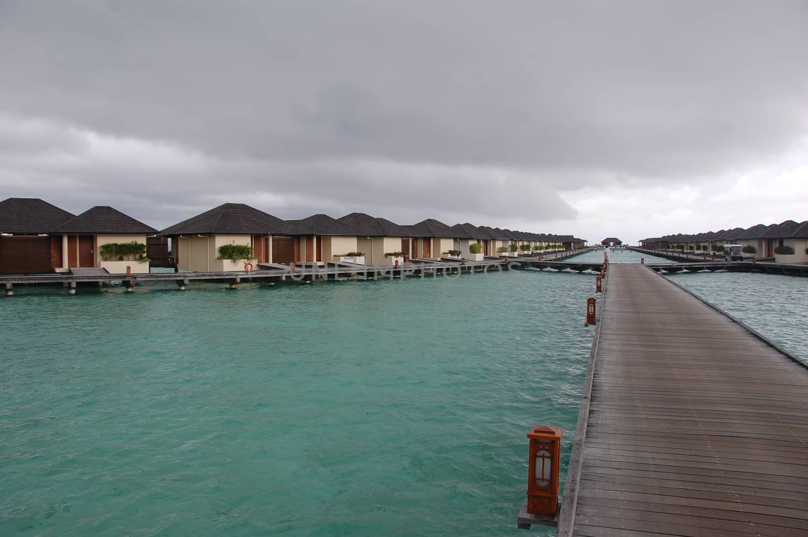 Timber pier and bungalow at Paradise Island Resort Maldives by danemo
