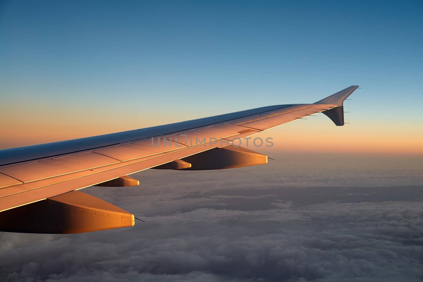 Airplane flying above clouds great travel transportation background image