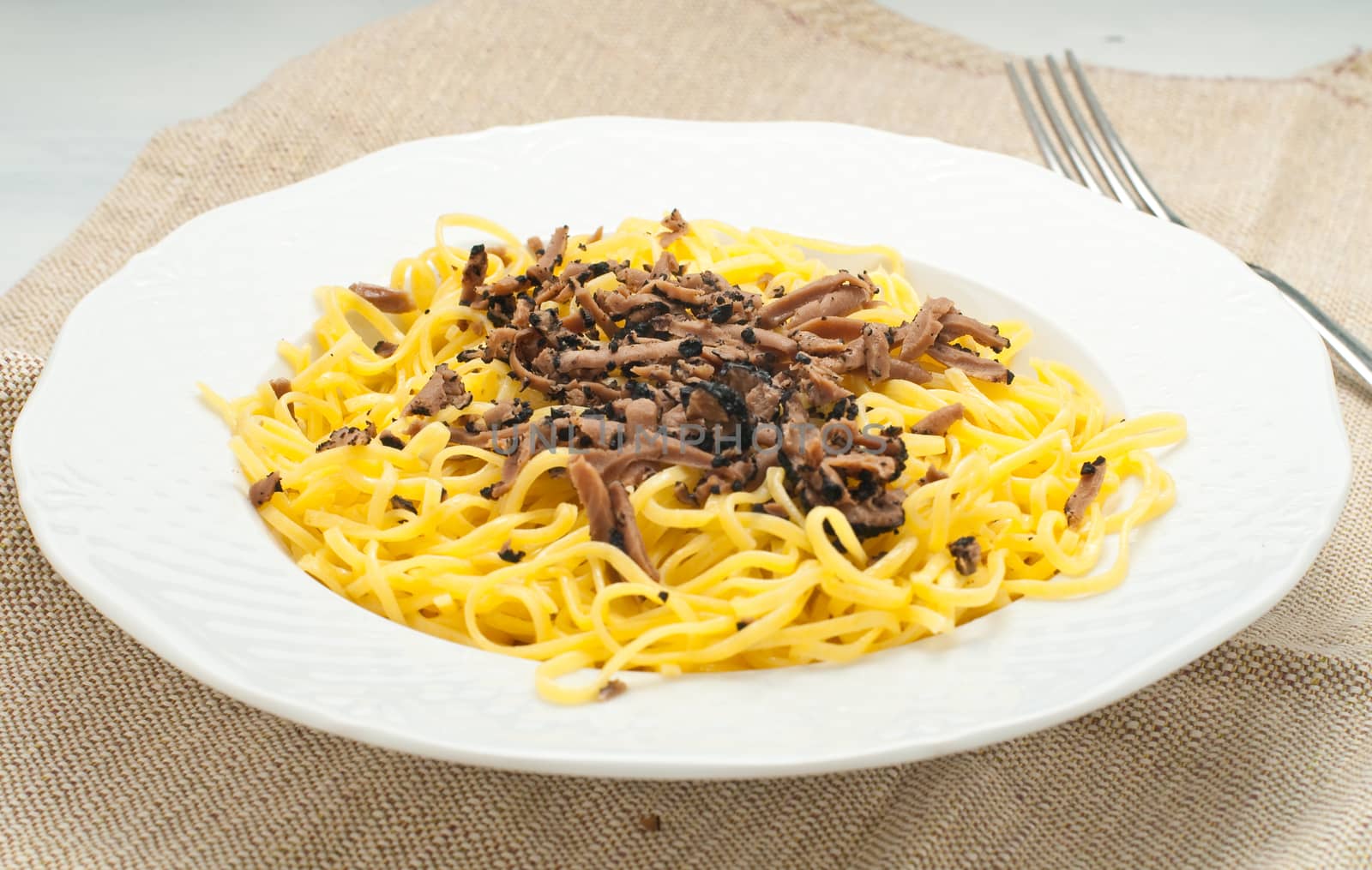 Pasta typical of Piedmont called tajarin with truffle, italy