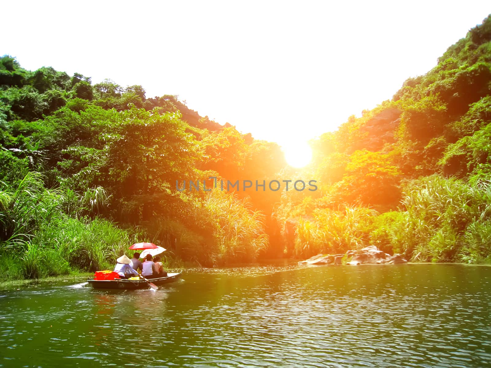 NINH BINH, VIETNAM, JULY, 20: Unidentified tourists in Trang An  on JULY, 20, 2013. Trang An is the scenic area, ranked special of Vietnam.