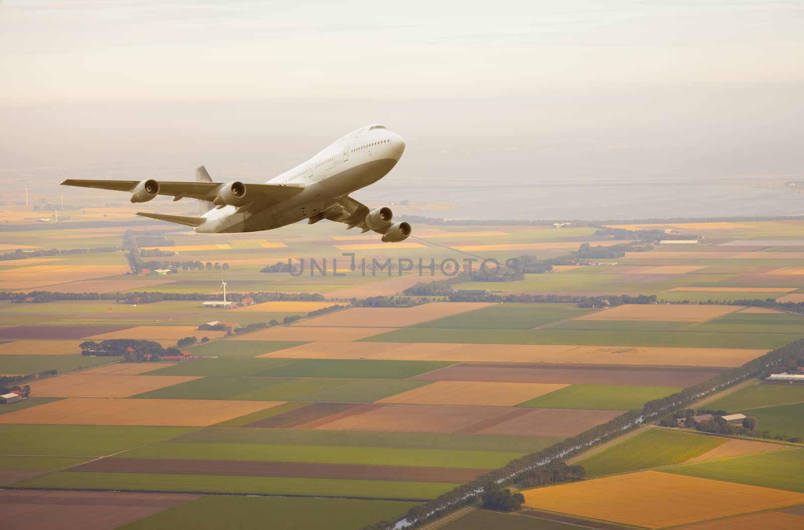 Airplane flying in beautiful sky above Netherlands