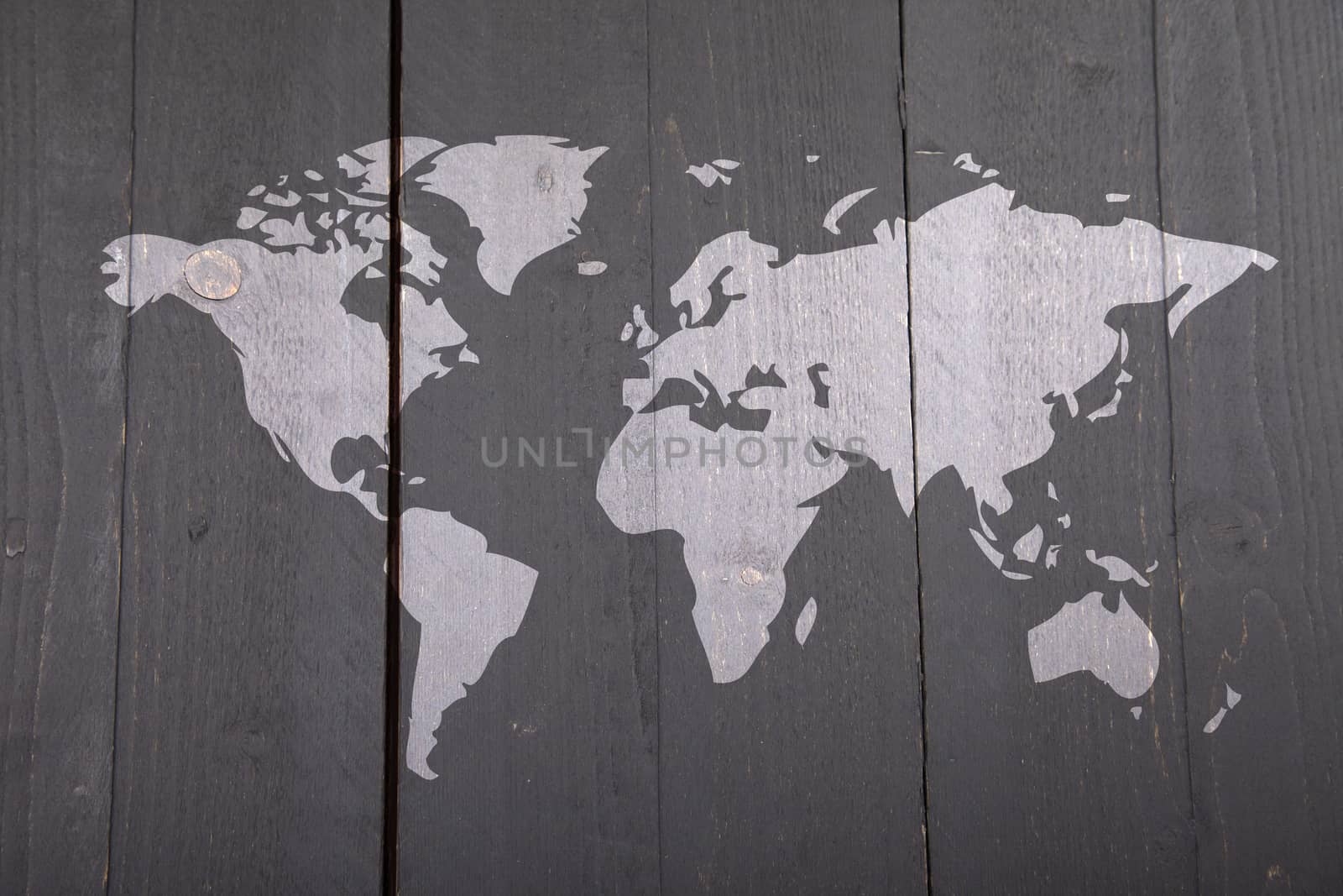 World map on dark black wooden background by gigra