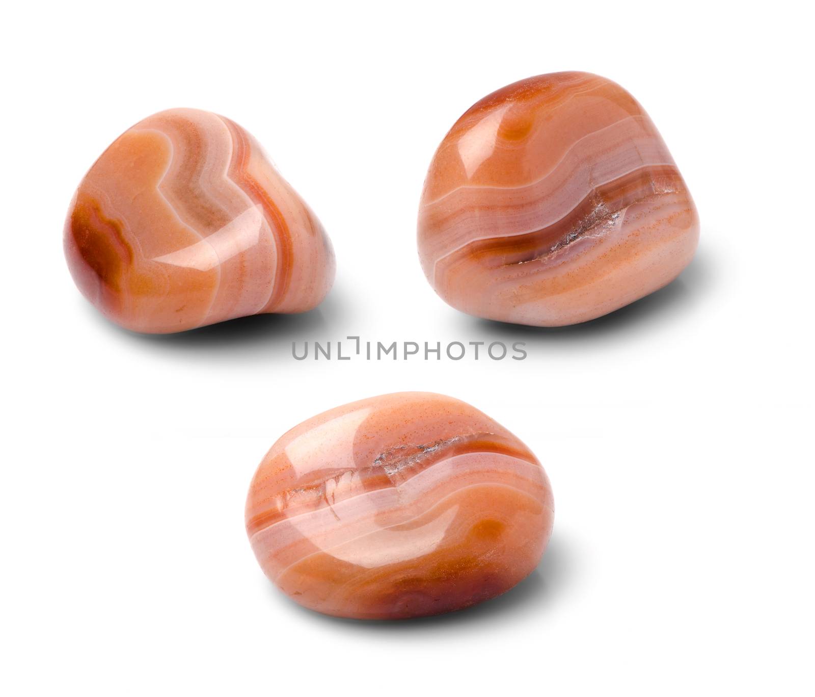 Sardonyx shot from three points of view isolated on white background.