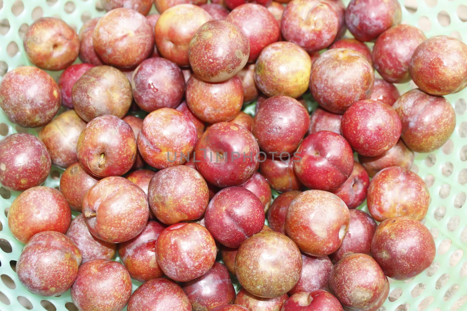 ripe plums on plate