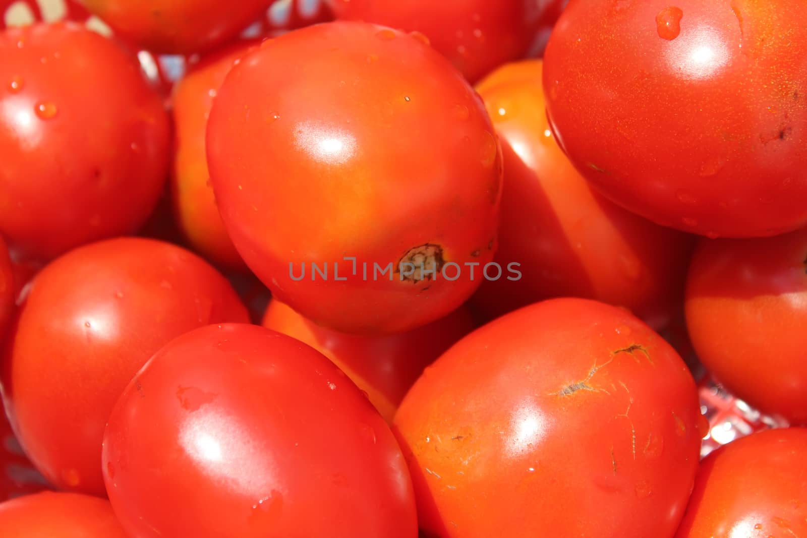 ripe tomatoes in basket by dinhngochung