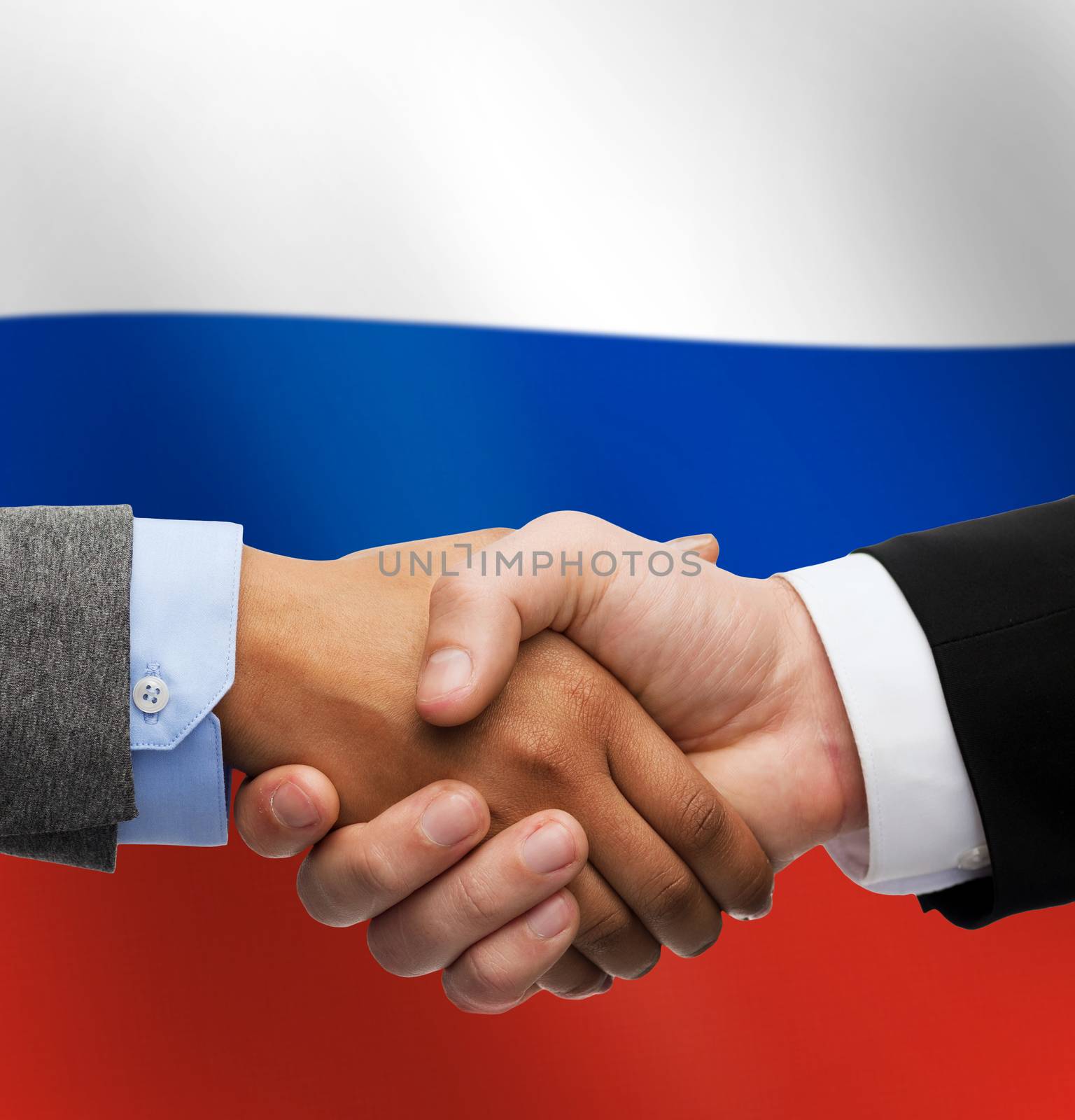 close up of handshake over russian flag by dolgachov