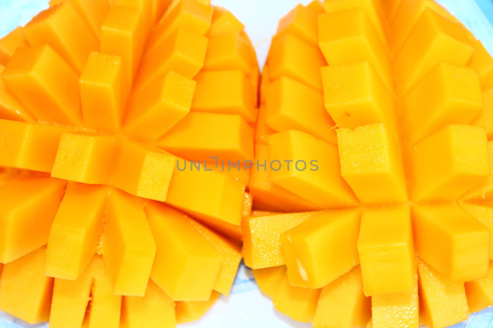 Mango slice cut to cubes close-up by dinhngochung