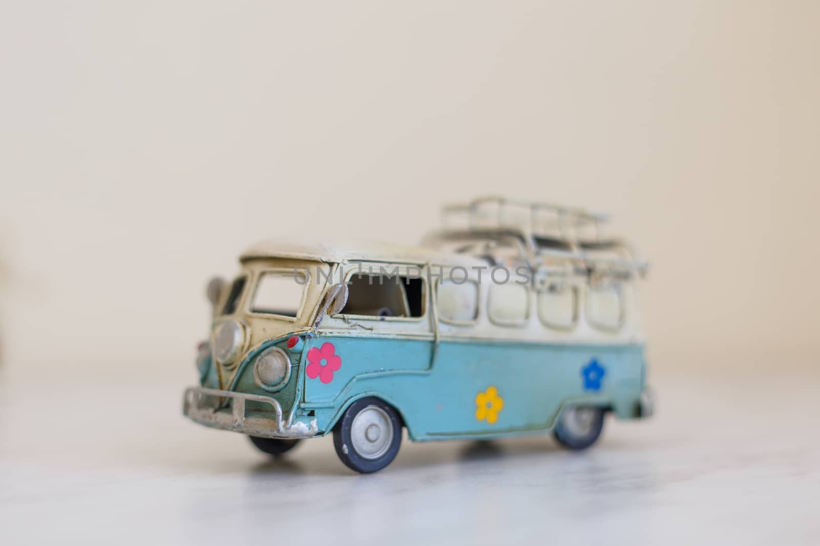 Close up detailed side view of white and blue vintage travel bus toy.