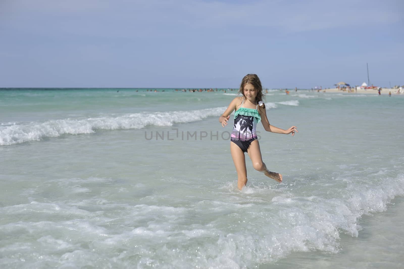 Happy girl has fun in the Caribbean sea.