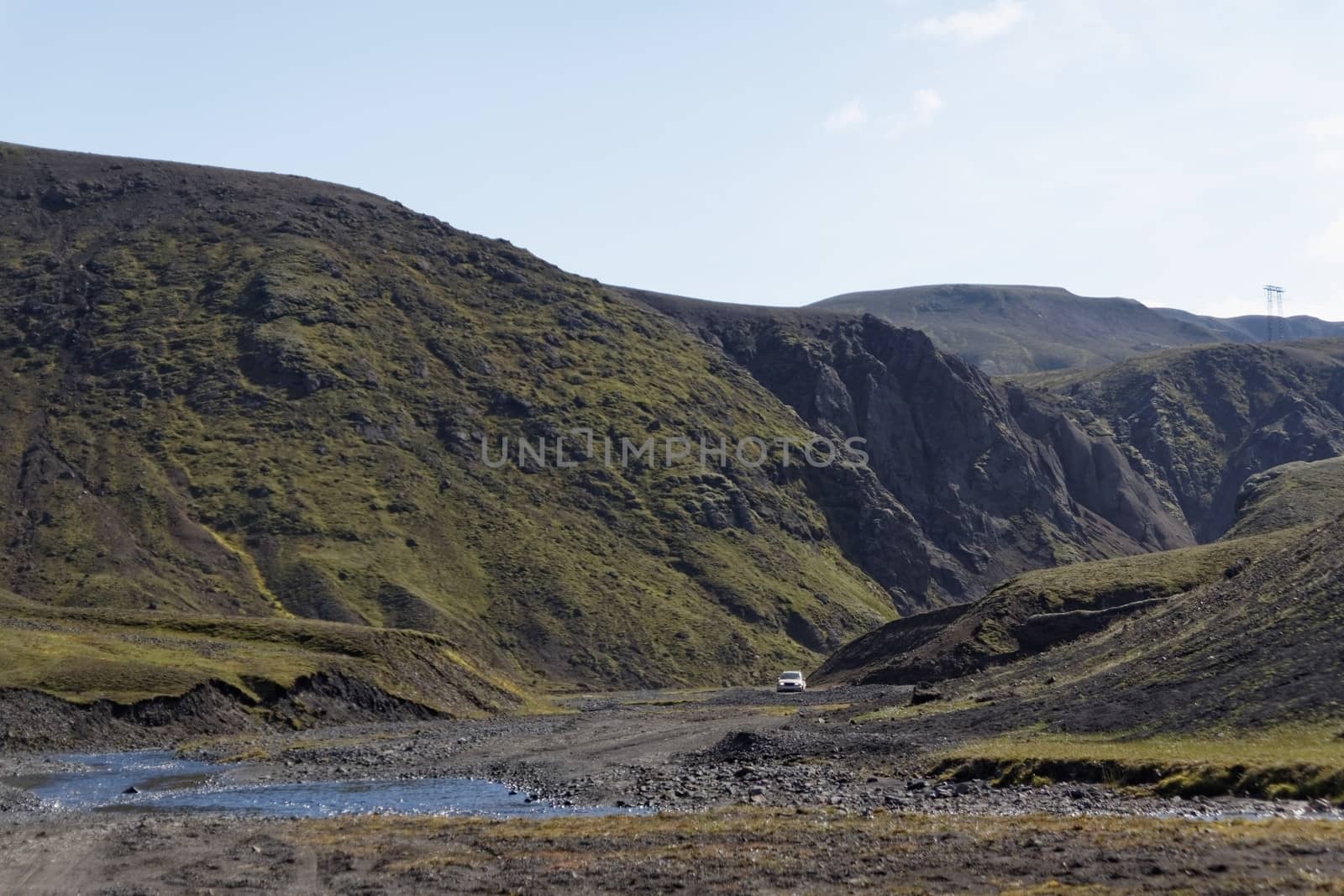 Landscape with river and the car in background in Iceland 