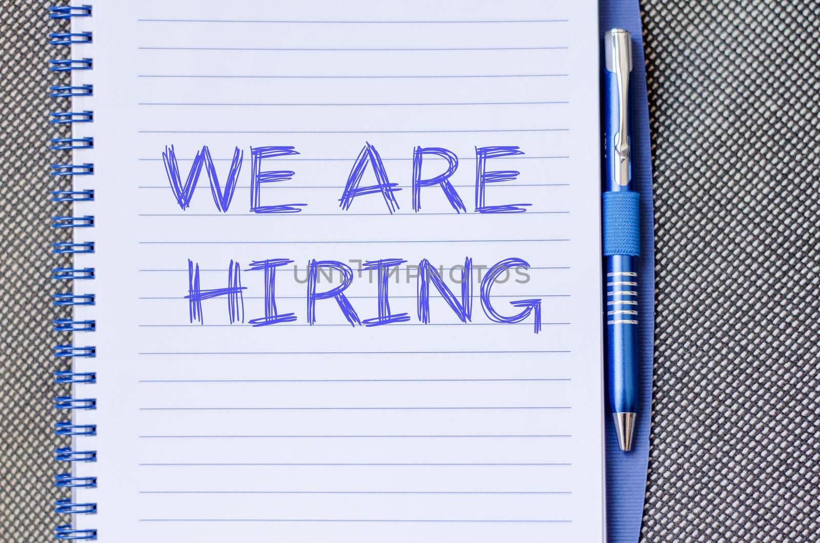 We are hiring text concept write on notebook