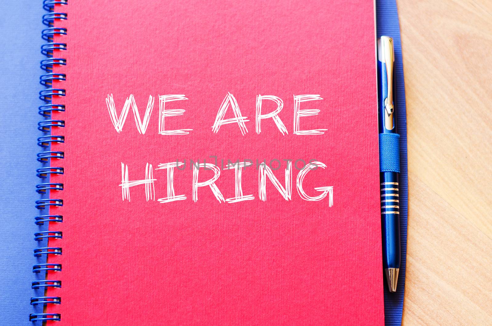 We are hiring text concept write on notebook