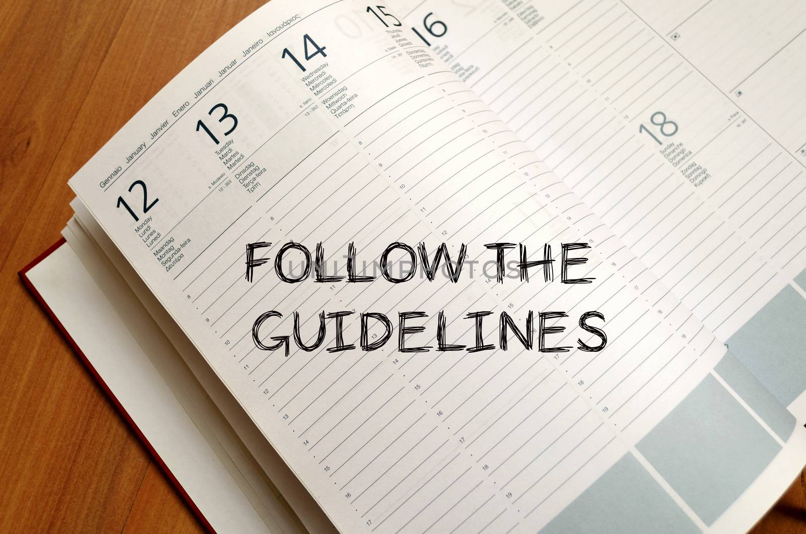 Follow the guidelines text concept write on notebook with pen