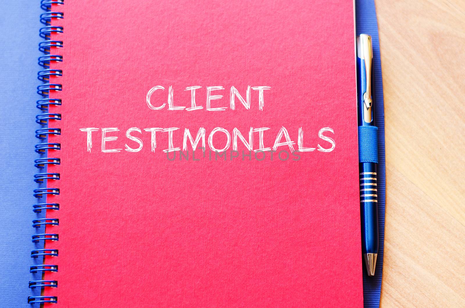 Client testimonials text concept write on notebook with pen