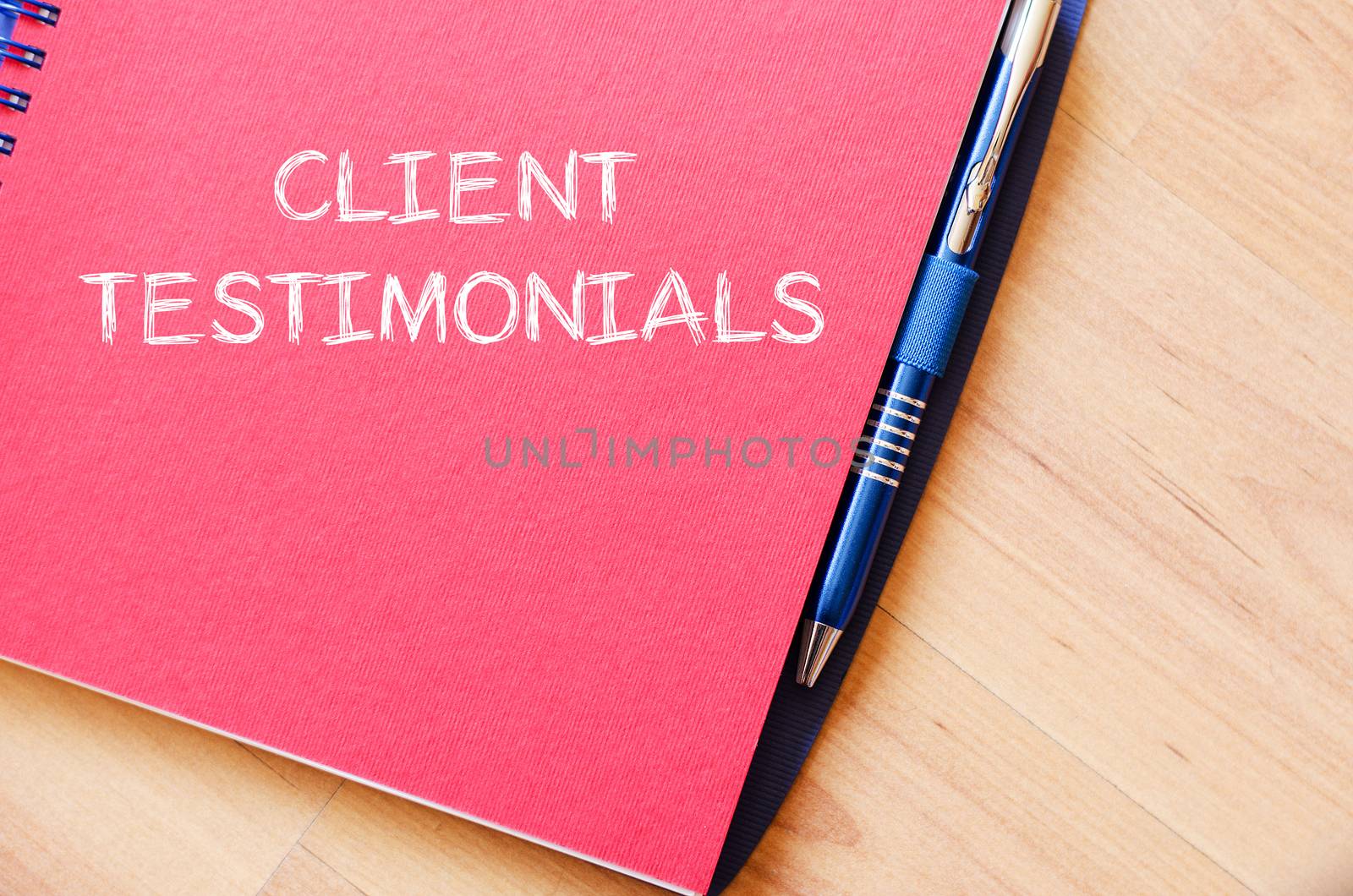 Client testimonials text concept write on notebook with pen