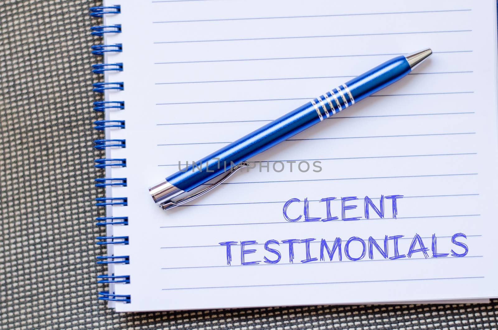 Client testimonials text concept write on notebook with pen