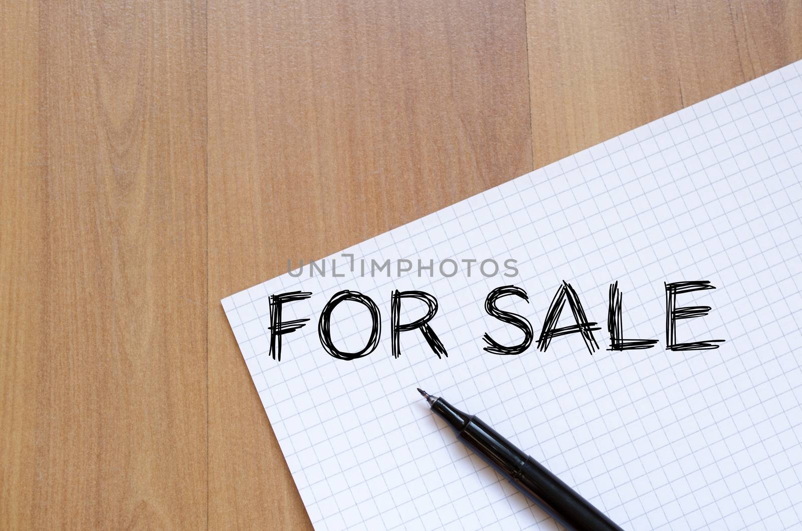 For sale text concept write on notebook with pen